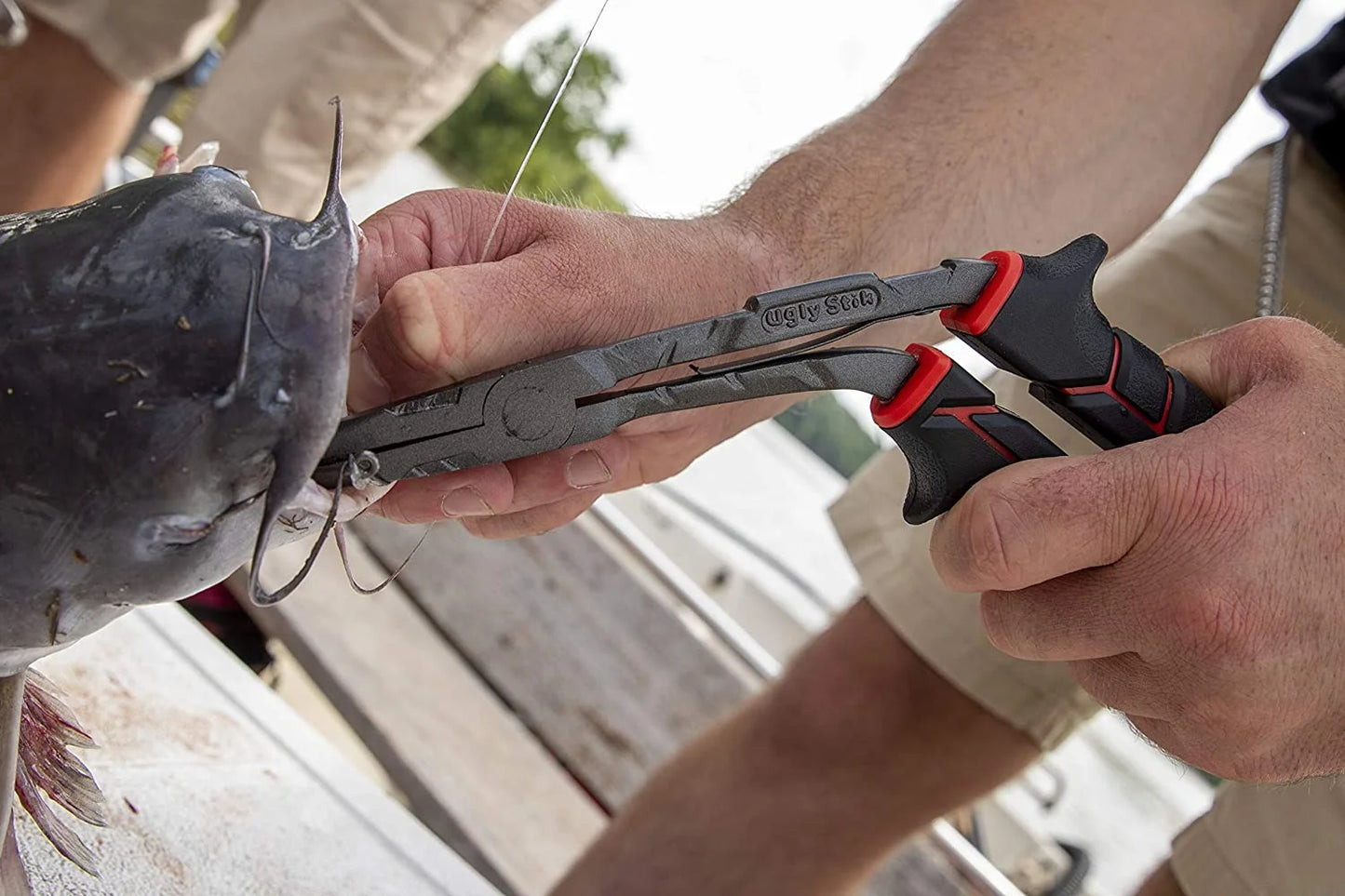 Bent nose fishing pliers with line cutter