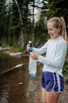 Sawyer Squeeze Water Filtration System for hydration, compact and portable water filter for outdoor activities and camping.