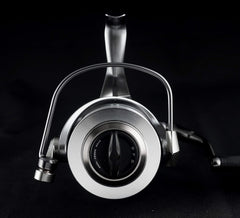 Okuma Coronado CDX lightweight baitfeeder saltwater reel with spool and handle, designed for saltwater fishing.
