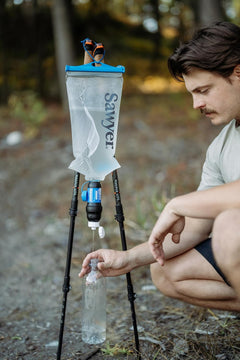 Sawyer Squeeze Water Filtration System for hydration, featuring compact design and durable filter for outdoor adventures.