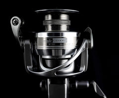 Okuma Coronado CDX lightweight baitfeeder saltwater reel mounted on fishing rod for saltwater fishing.